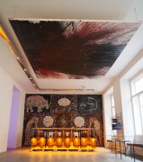 Exhibition view “Saturnalia II” with a ceiling painting by Hermann Nitsch and an installation by Paul Renner